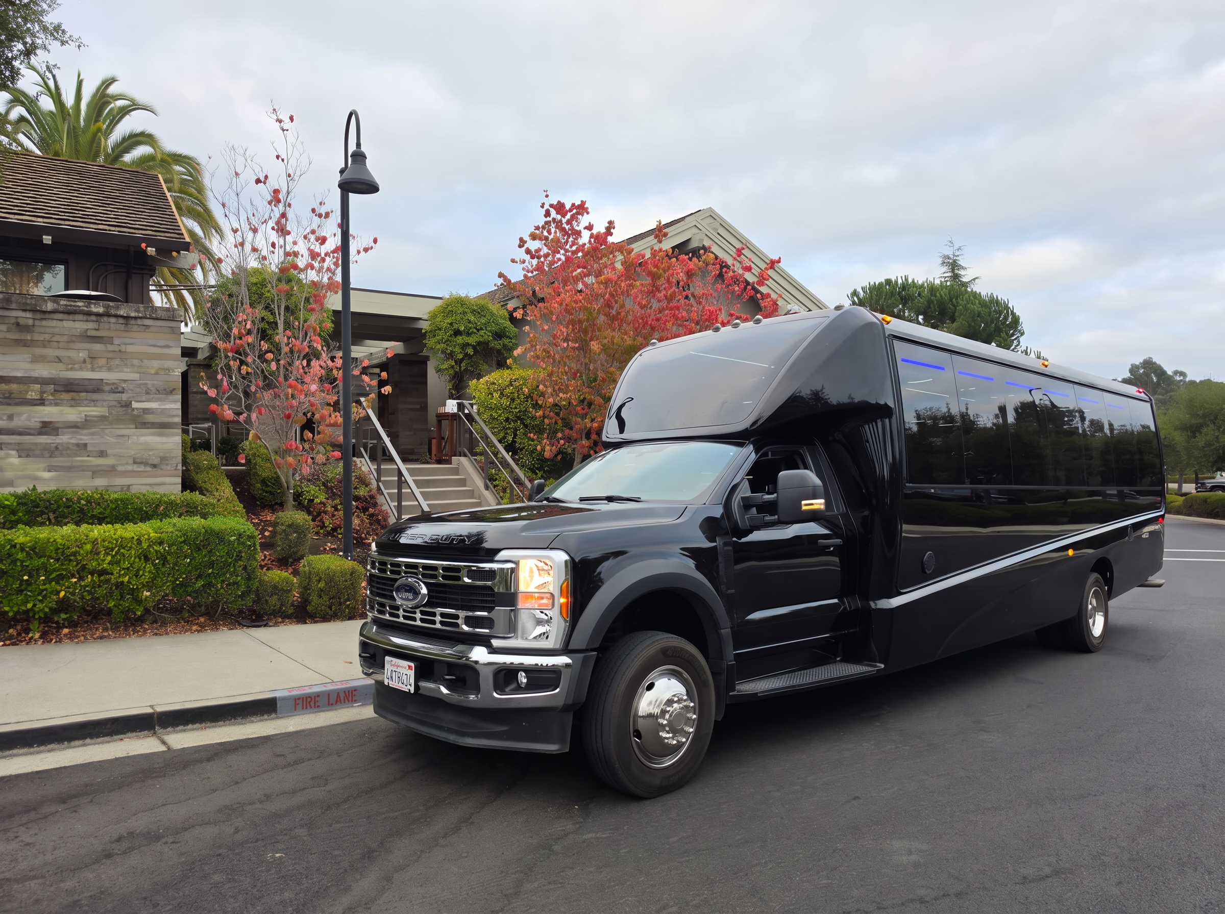 Black executive shuttle bus at a Napa Valley resort for SFO to Napa group airport transportation